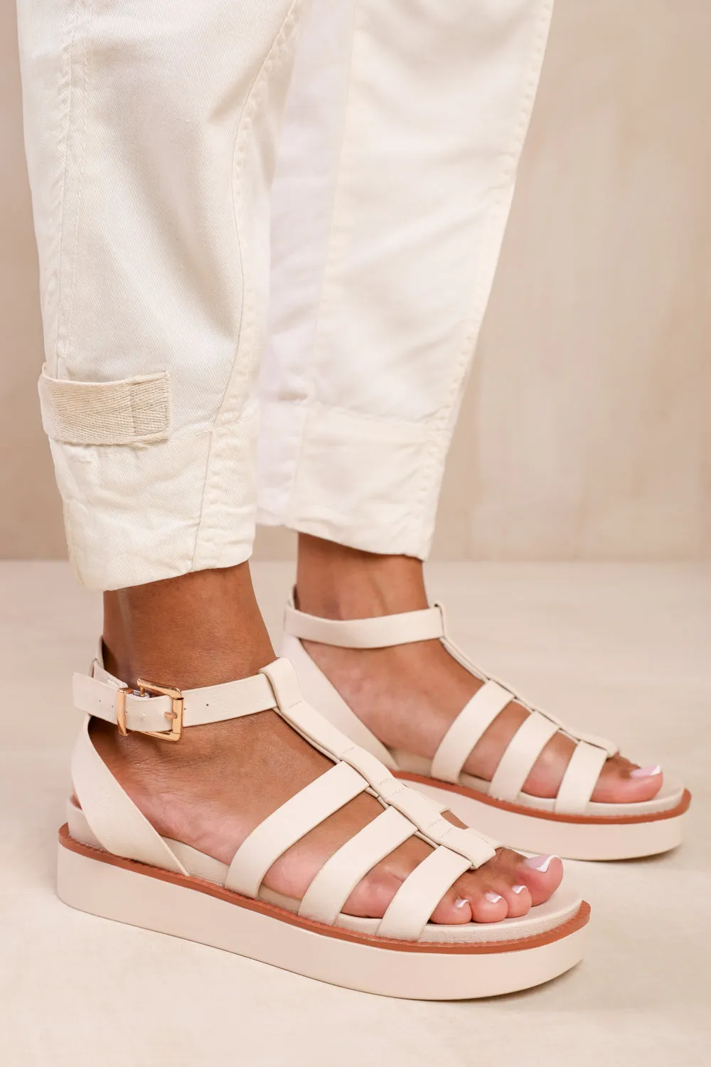 DUBAI EXTRA WIDE FIT MID PLATFORM GLADIATOR STRAP IN CREAM PU