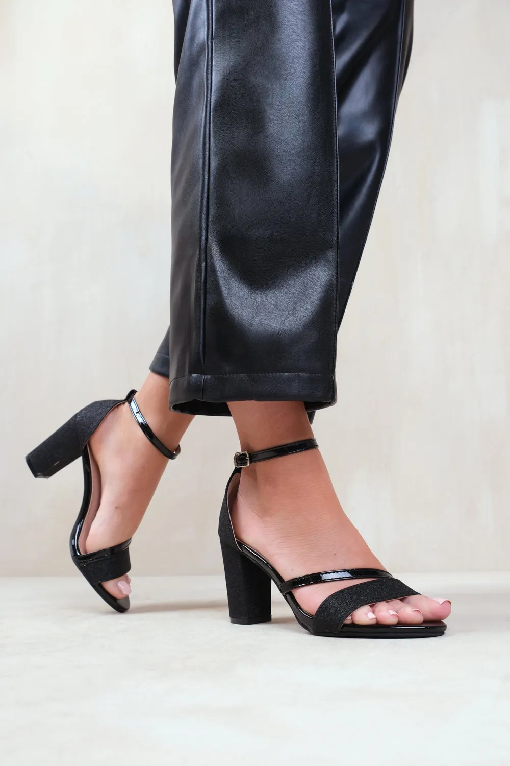 PERLA MID HIGH BLOCK HEEL SANDALS WITH ANKLE STRAP IN BLACK GLITTER